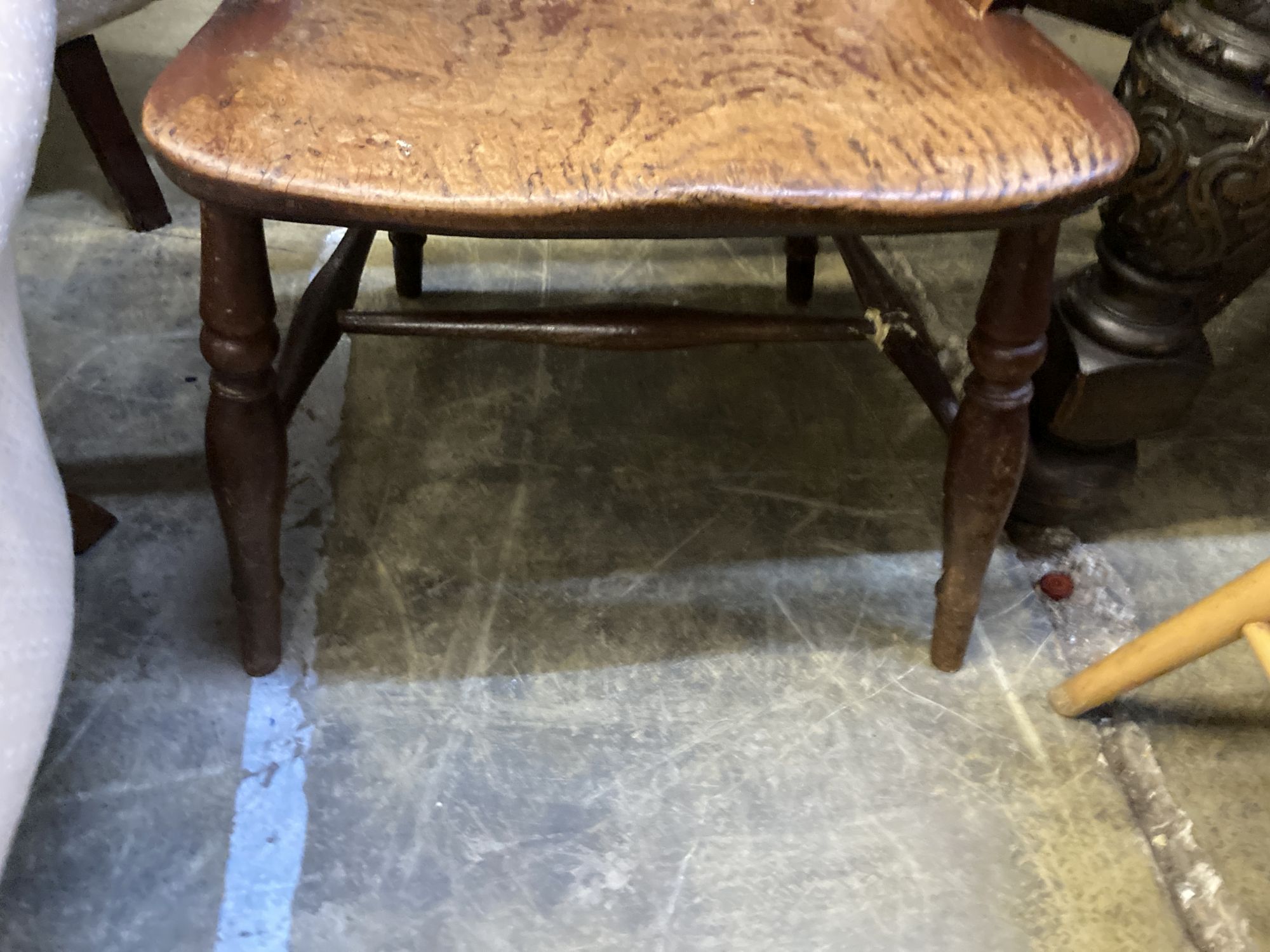 A 19th century ash and beech ladderback elbow chair and a spindle back elbow chair (2)